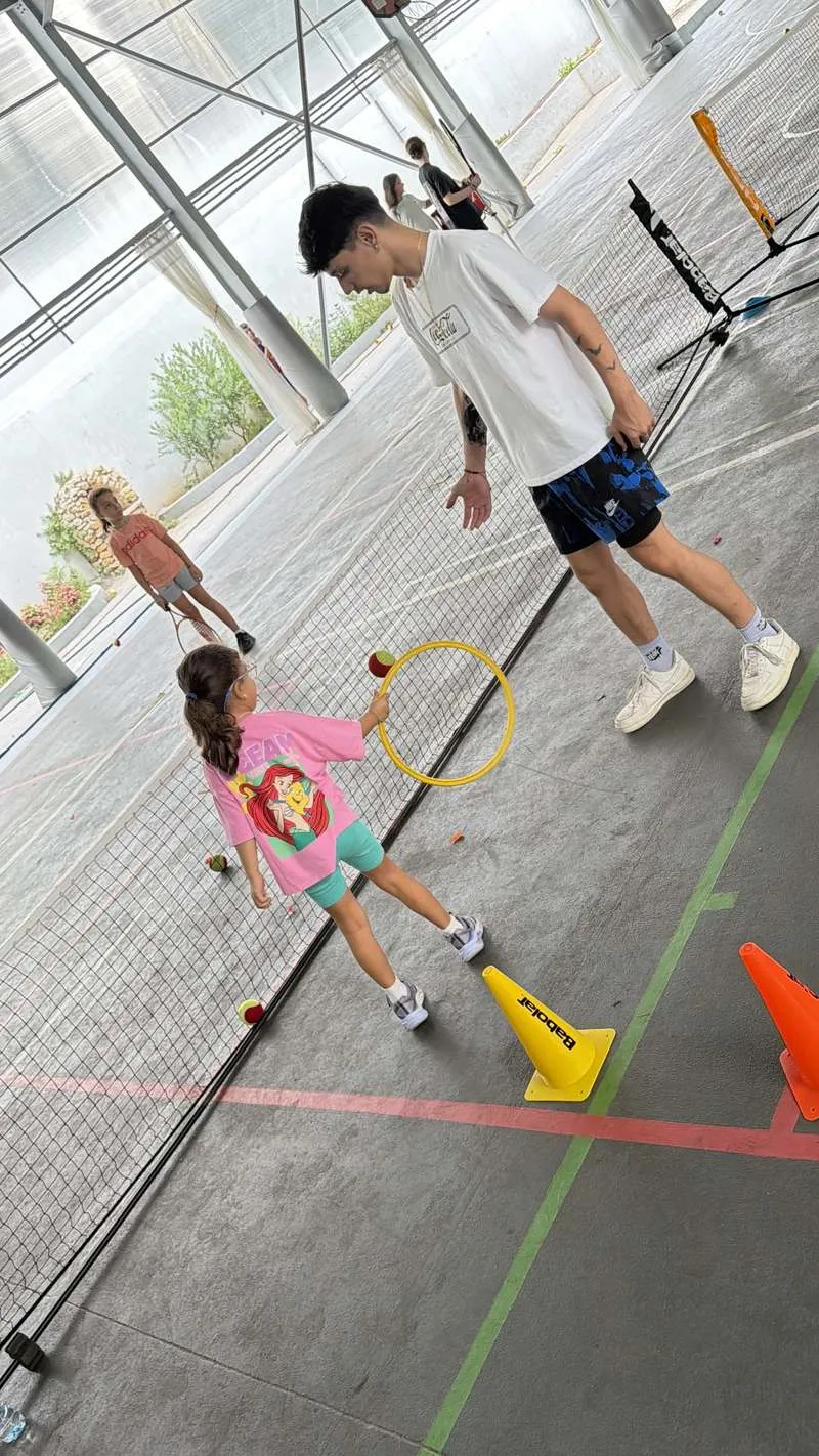 Coach running a drill with a young player
