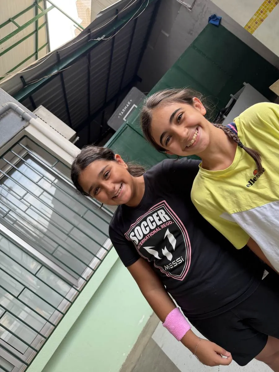 Two students smiling after practice